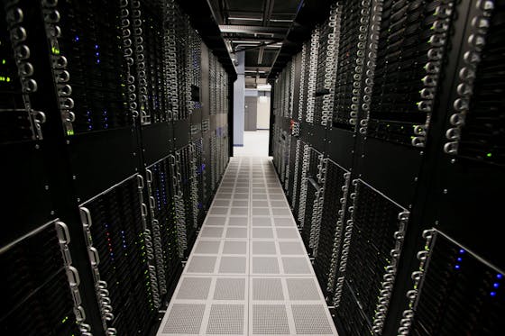 Servers and hard drives stand inside pod one of IBM's Softlayer data center in Dallas.